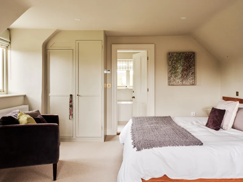 Bedroom opening towards an adjoining bathroom