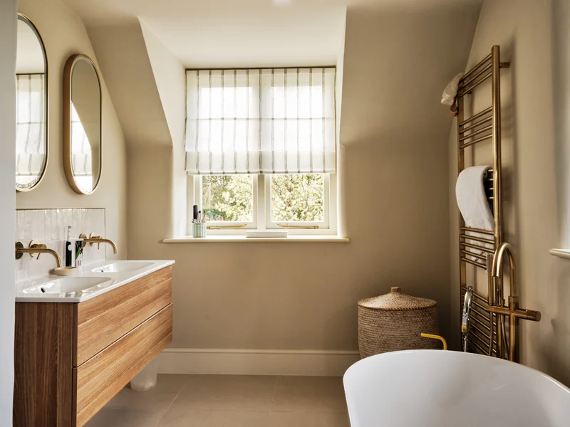 Bathroom with timber vanity, freestanding bath and sash window