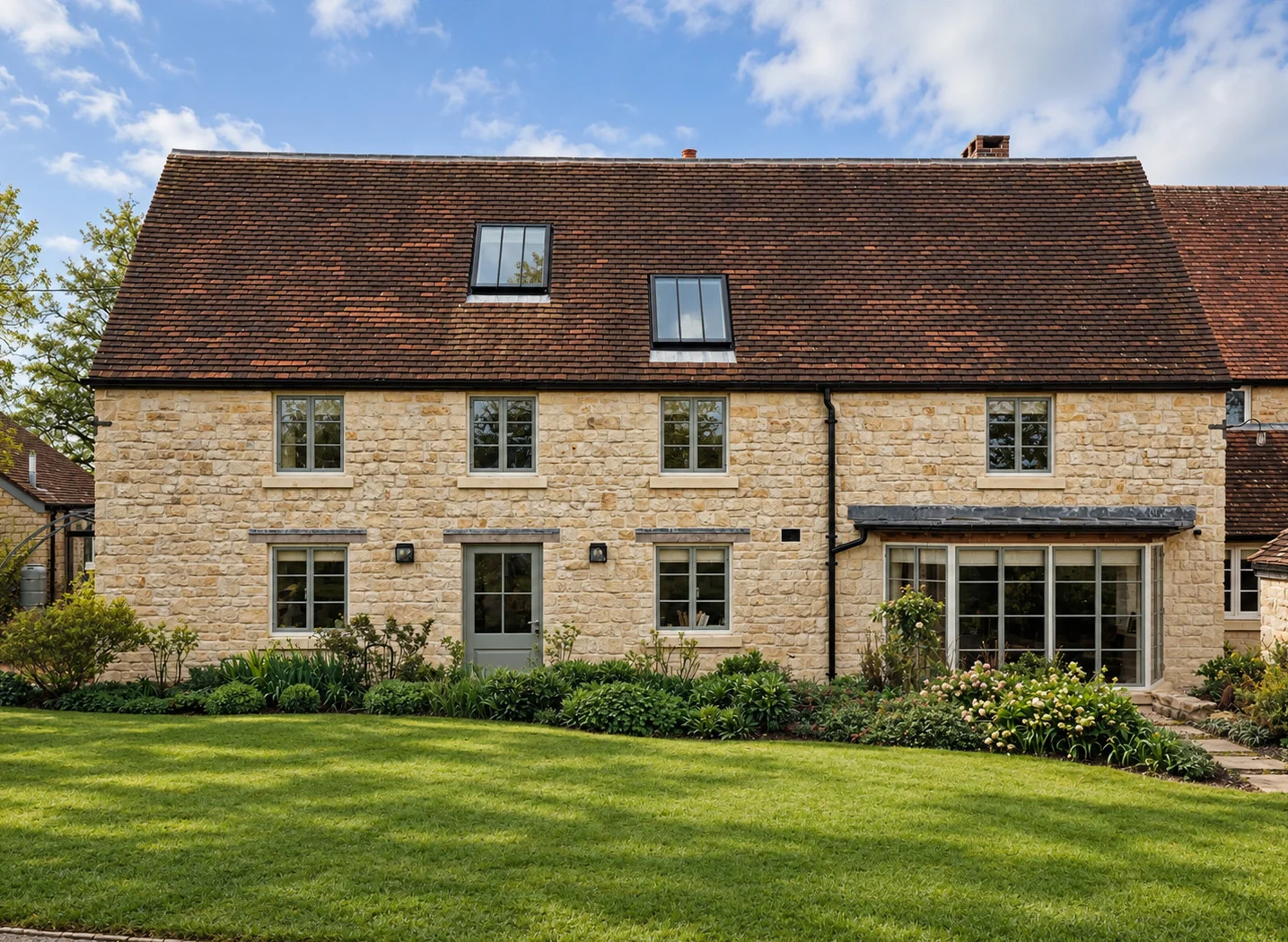 Stone country house viewed from the garden