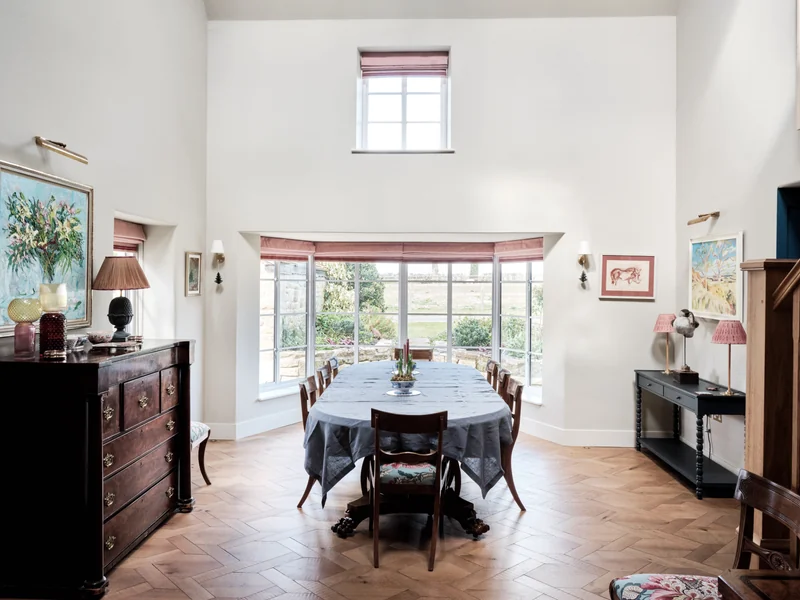 Double-height dining space overlooking the garden